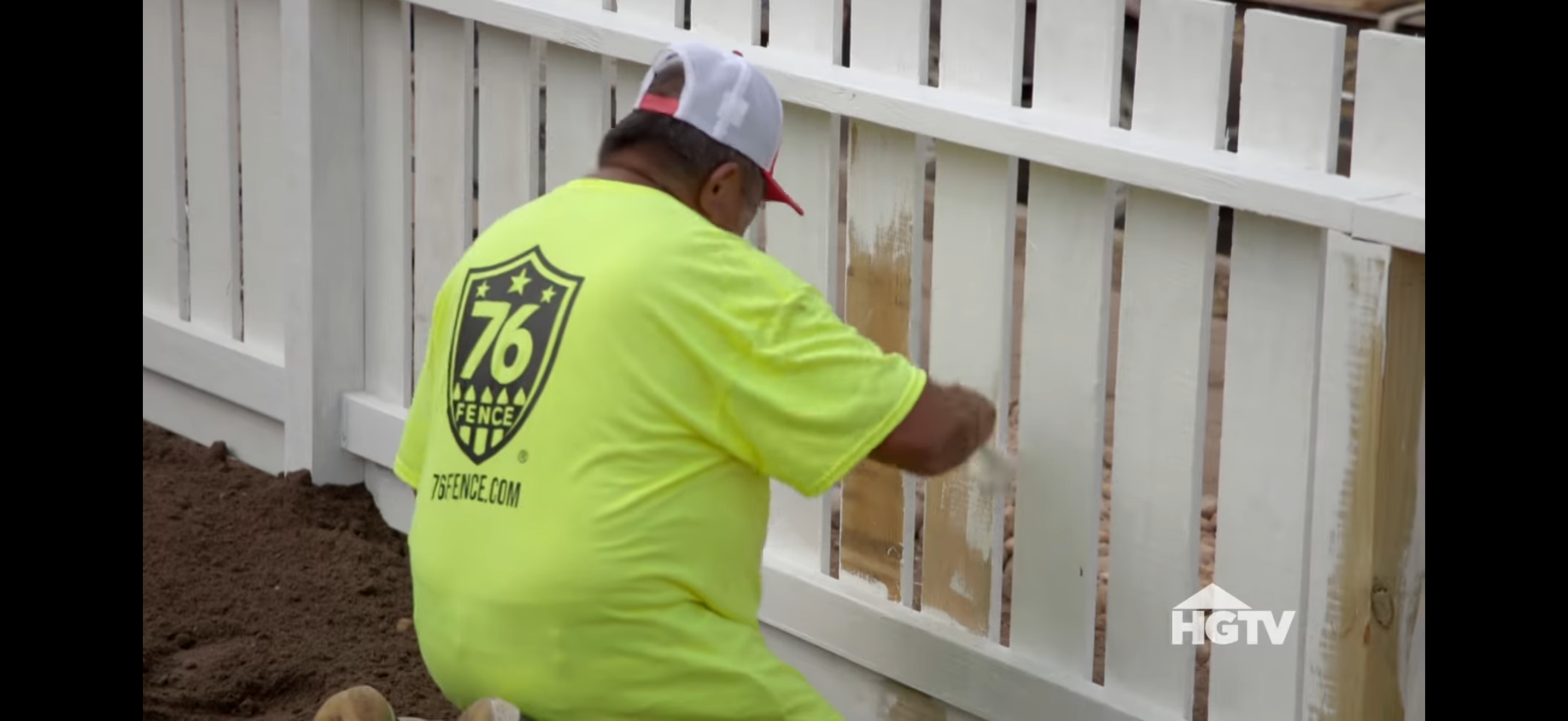 A 76 Fence technician expertly installing a fence for a Houston family on HGTV's Worst Yard on the Block
