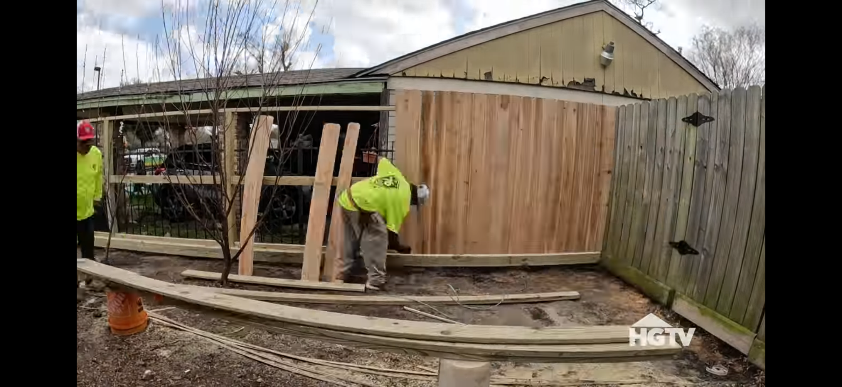 The 76 Fence team expertly installing a fence for a Houston family on HGTV's Worst Yard on the Block