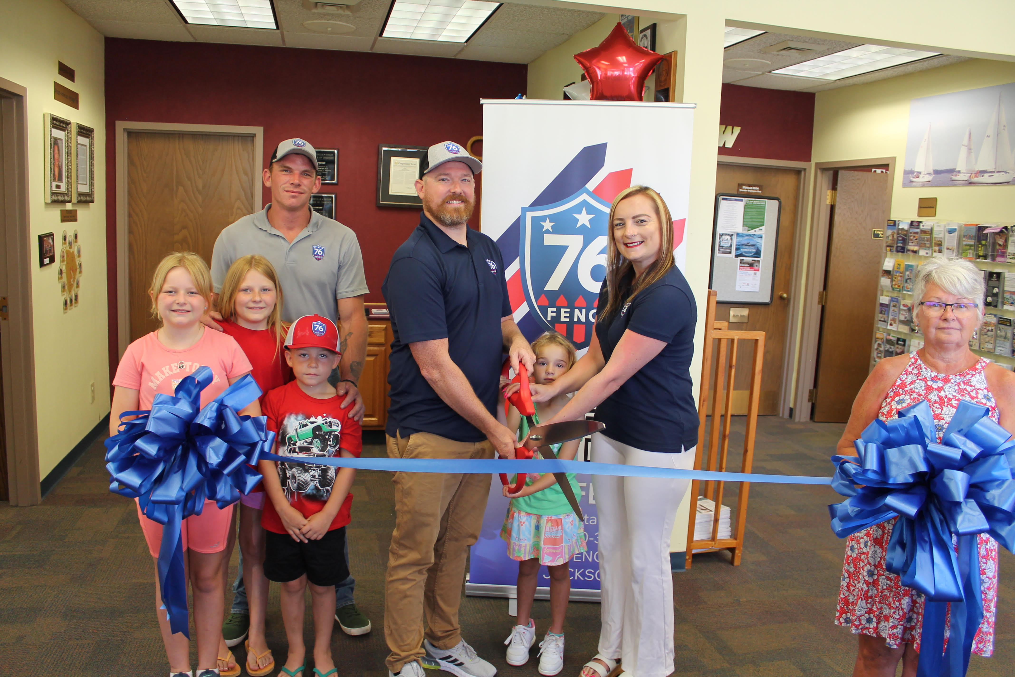 Philip and Candace Hixon of 76 Fence Coastal Carolina and 76 Fence East Wilmington stand alongside their family, team members and Chamber of Commerce representatives at their ribbon cutting ceremony.