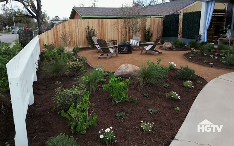 A close up shot of the front yard of a home from HGTV's Worst Yard on the Block