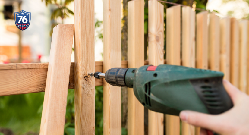 A 76 FENCE technician fixing a fencing mistake - contact us to learn more about the mistakes to avoid when installing a fence in Schaumburg, IL!