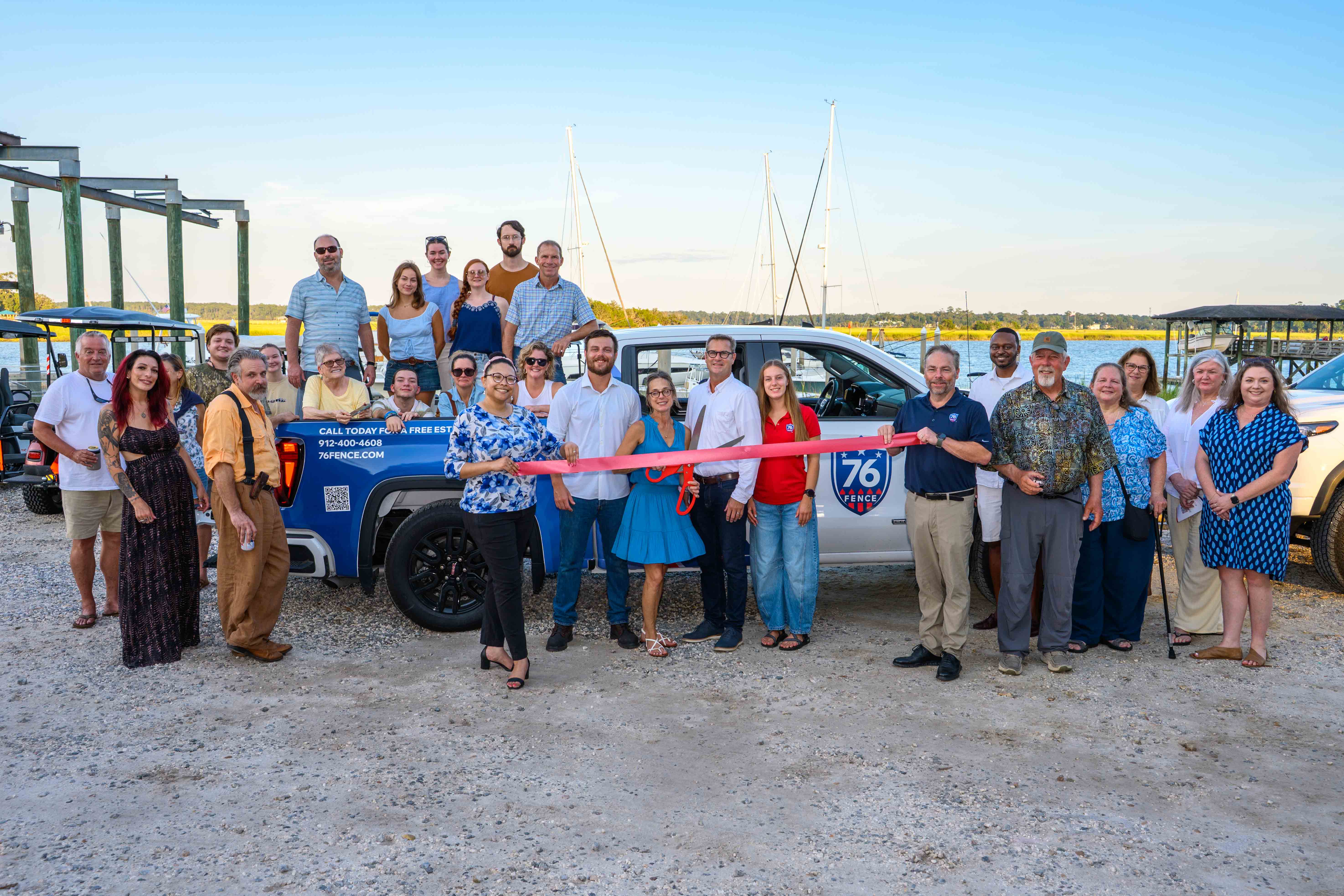 An image of the ribbon cutting ceremony for 76 Fence Southern Lowcountry grand opening.