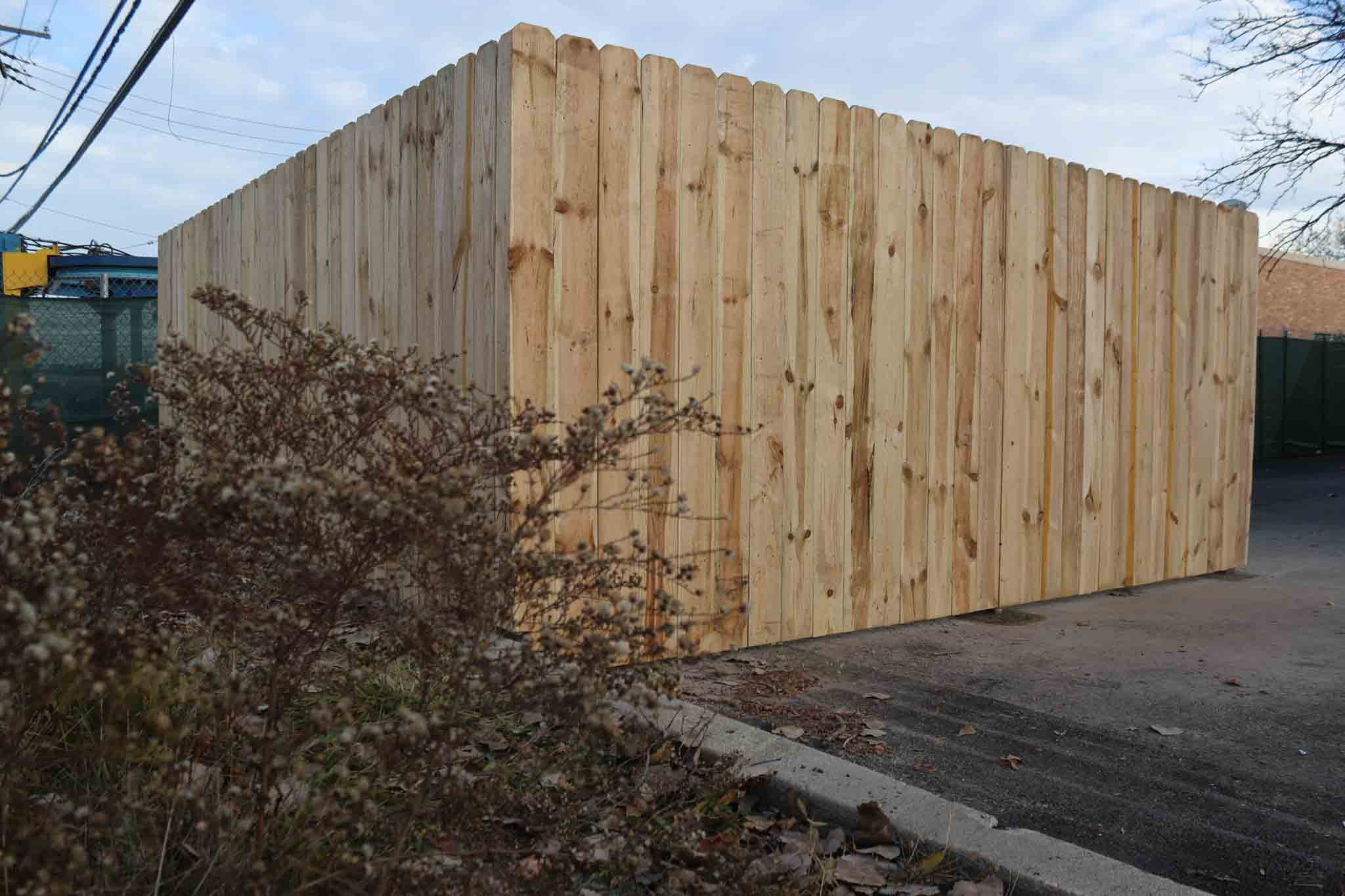 A 76 FENCE North Charlotte commercial dumpster enclosure gate.