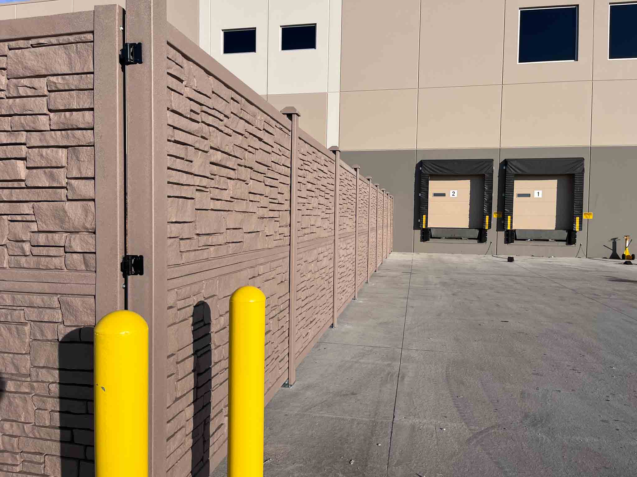 A industrial fencing solution in Jacksonville, NC for a commercial warehouse.