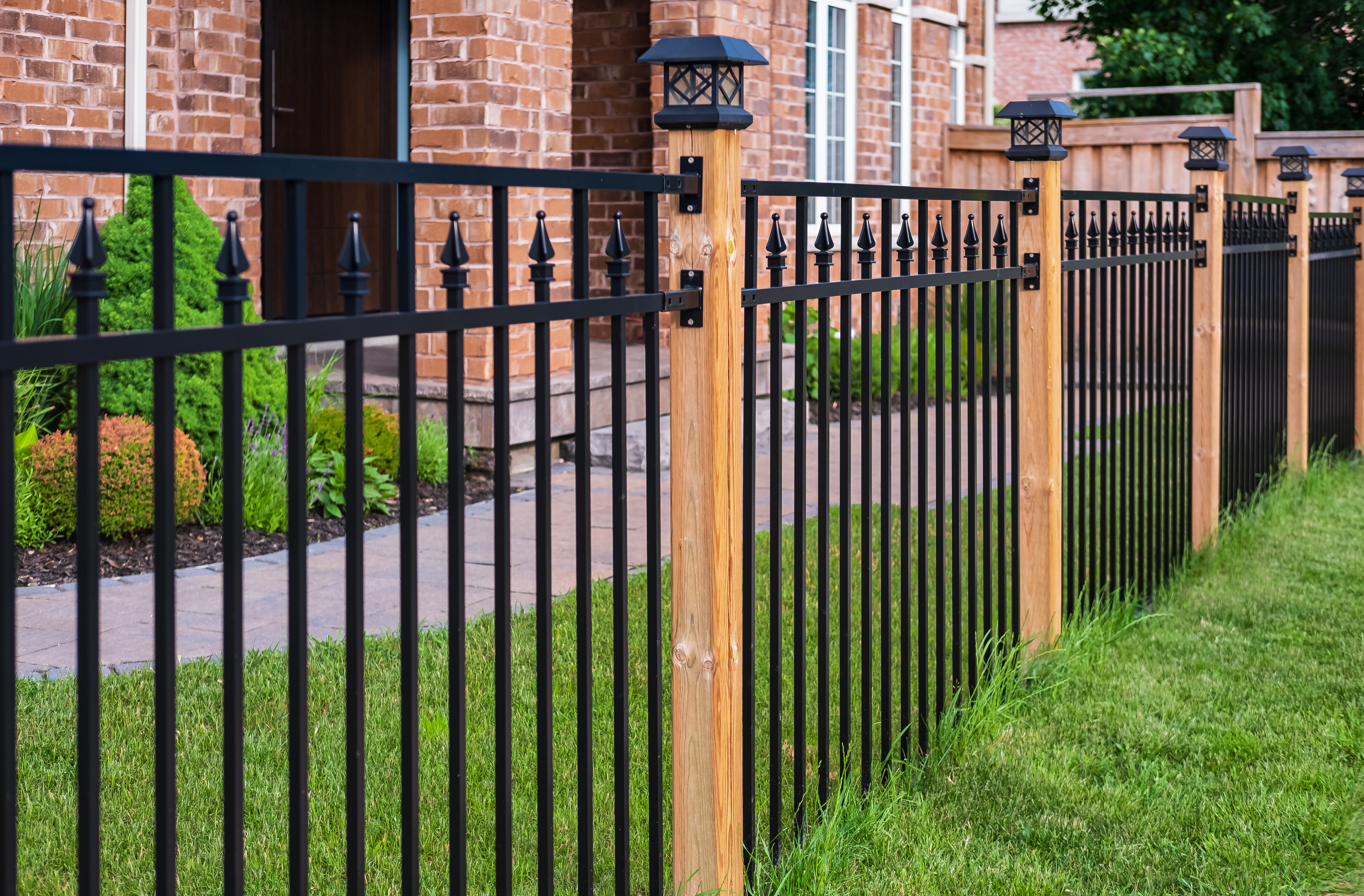A durable wrought iron fence built and installed by the experts at 76 Fence.