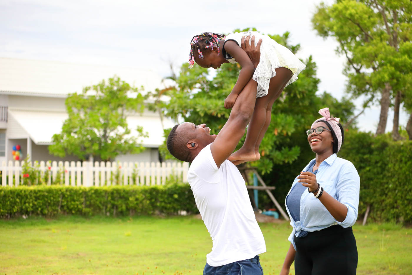 A family playing with their kids, our 76 FENCE fence company provided financing options, making your backyard a second home.