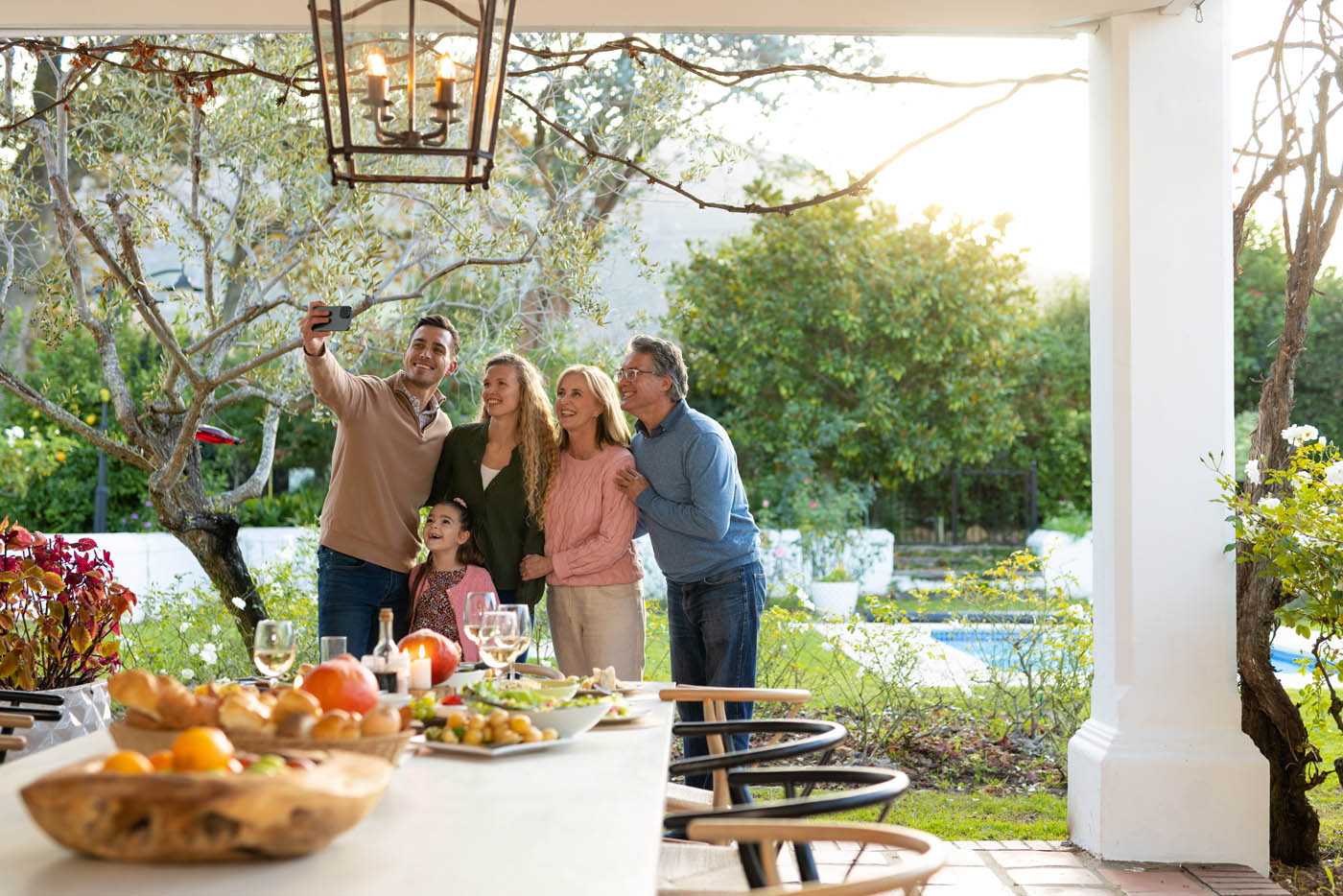 A family enjoying their backyard and fence that provides privacy for their events - contact 76 FENCE today for professional fence installation in Gold Hill, NC.