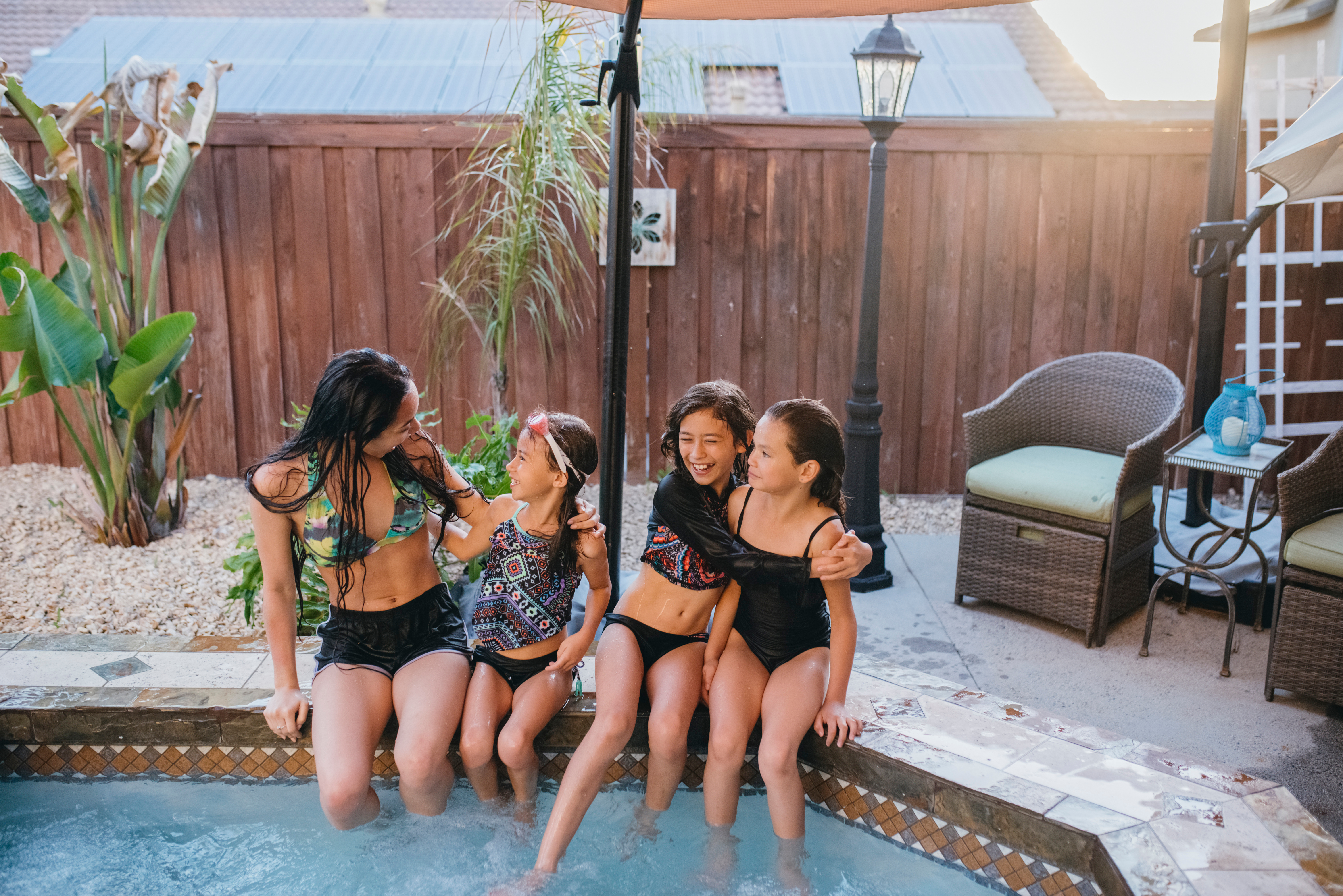 A family enjoying their outdoor pool.