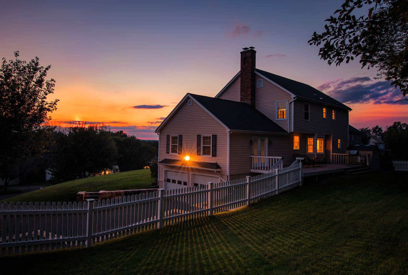 A residential fence surrounding a home, provided by 76 FENCE one of the top fence companies.