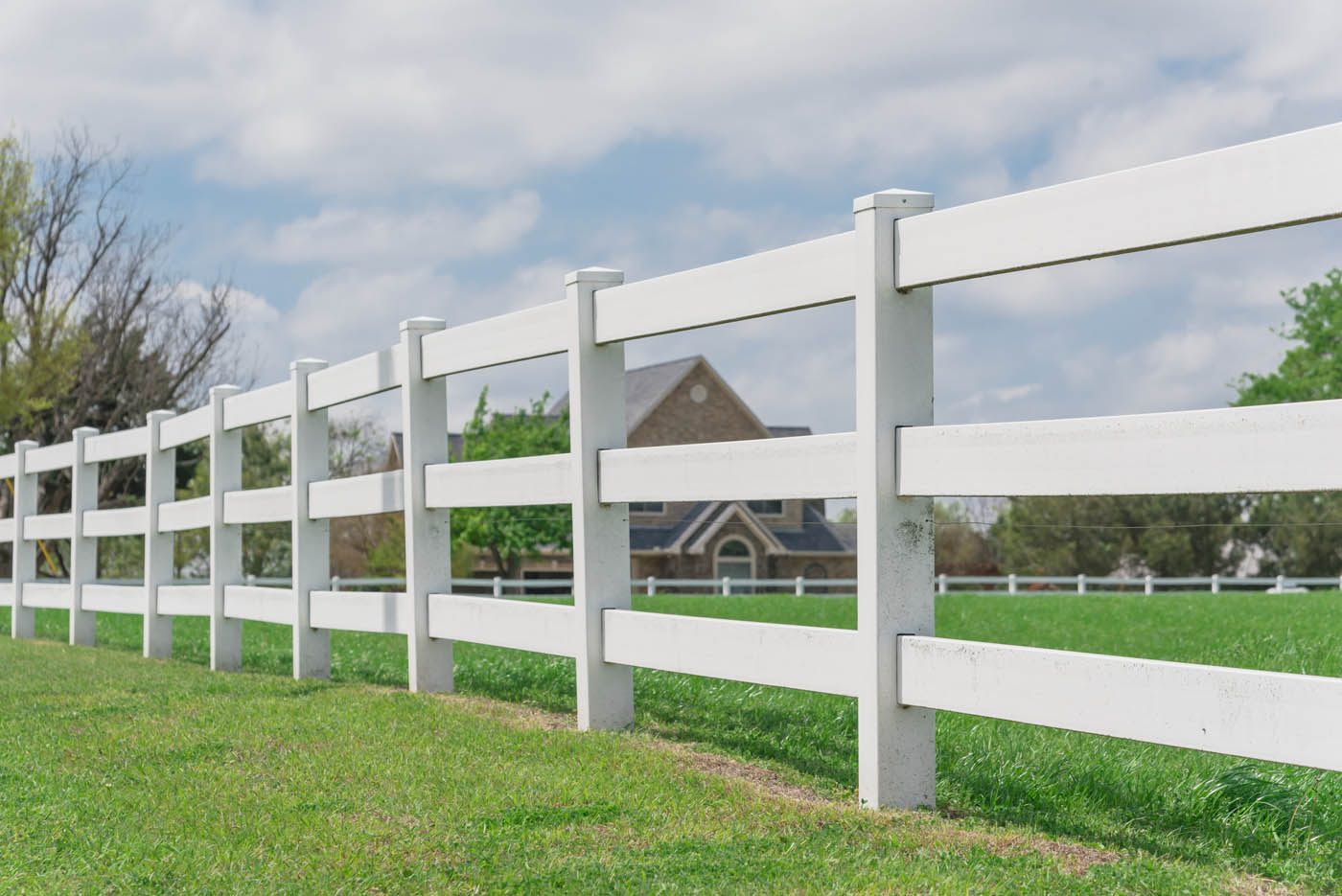 A stunning, white ranch fence - 76 FENCE is your top farm fence installers.