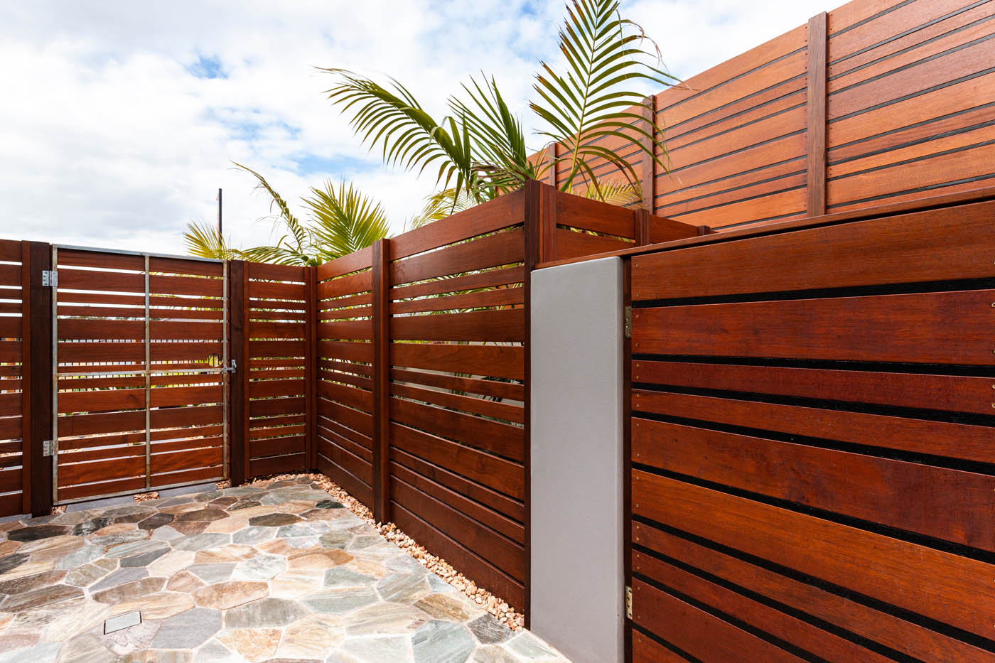 A residential property with a horizontal fencing design - 76 FENCE offers high-quality horizontal front yard fences for residents.