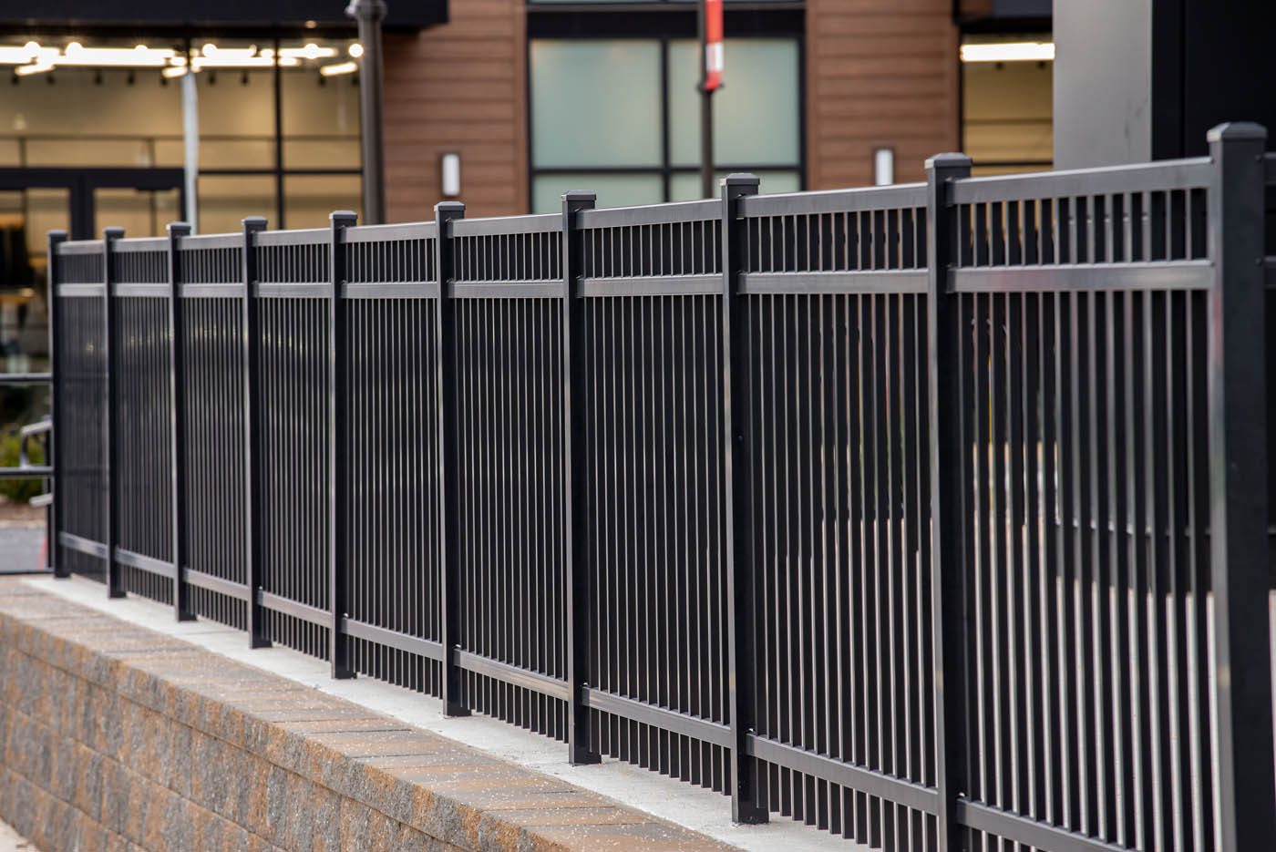 A black aluminum, residential fence.