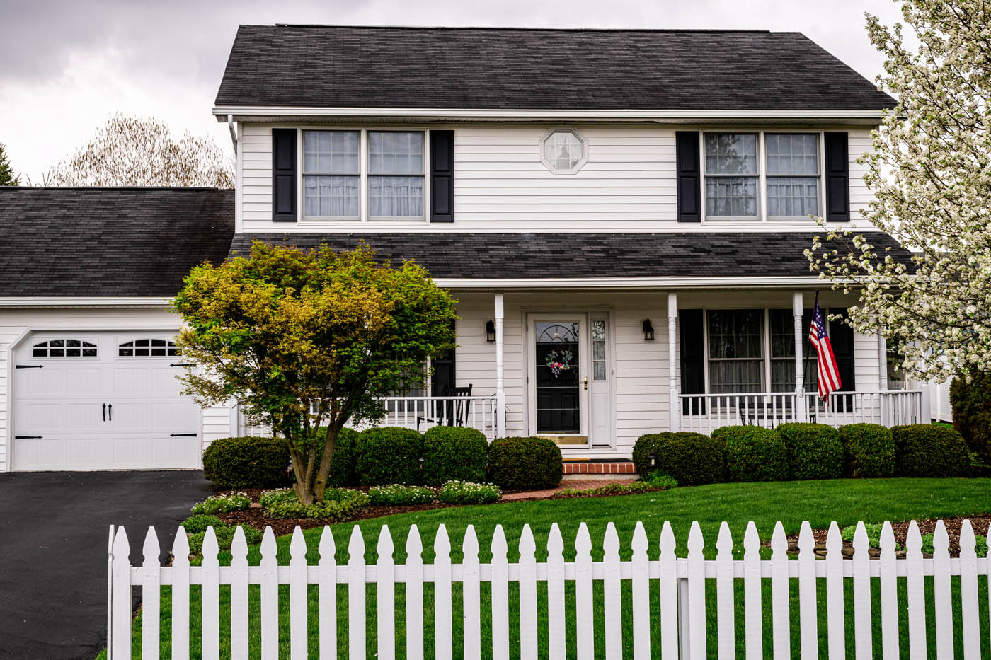 A beautiful residential property with a picket fence - contact 76 FENCE today for all your residential fencing needs in Murfreesboro / Franklin, TN.