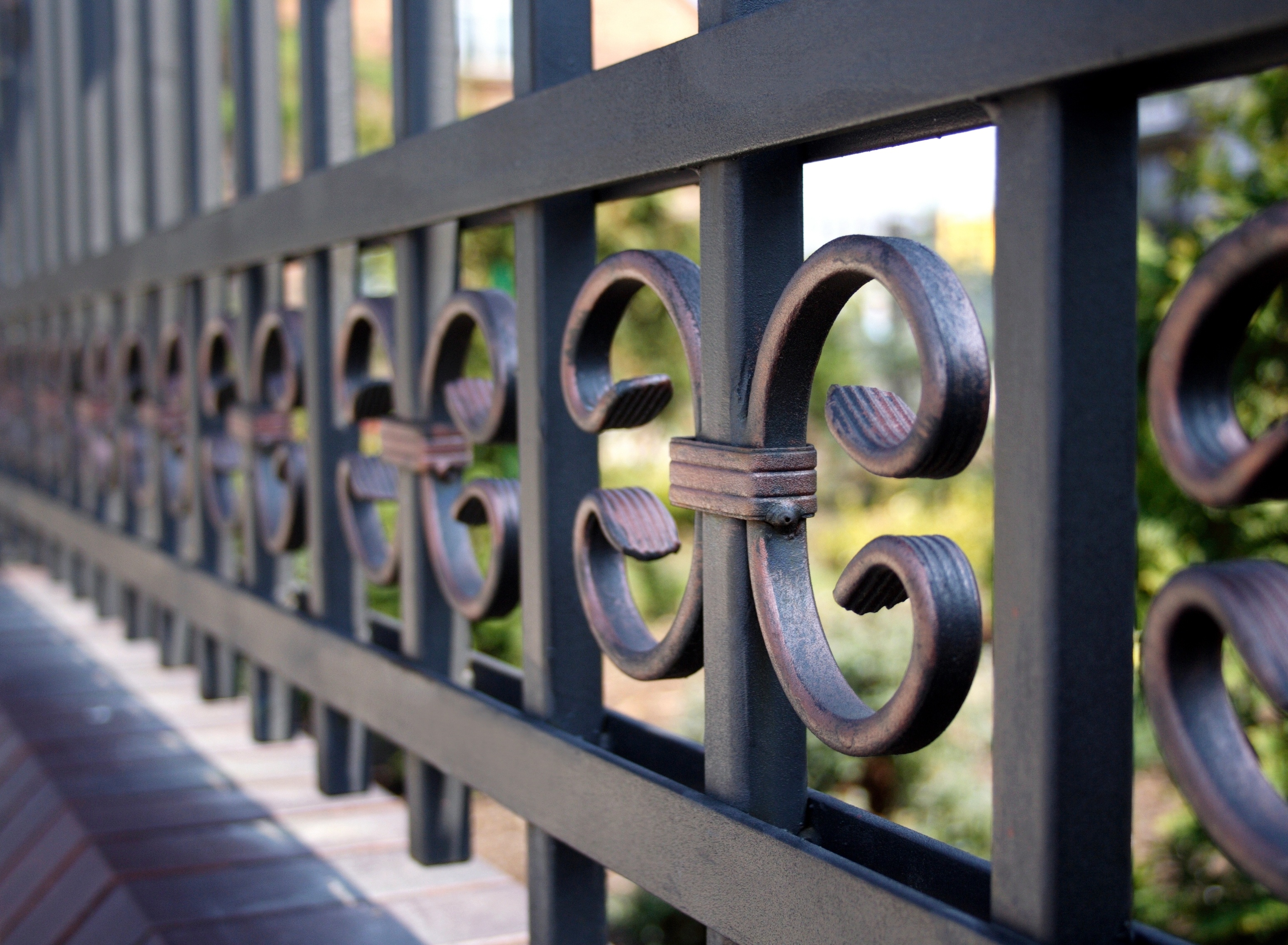 A zoomed in shot of 76 Fence's Kennesaw wrought iron fencing installation.