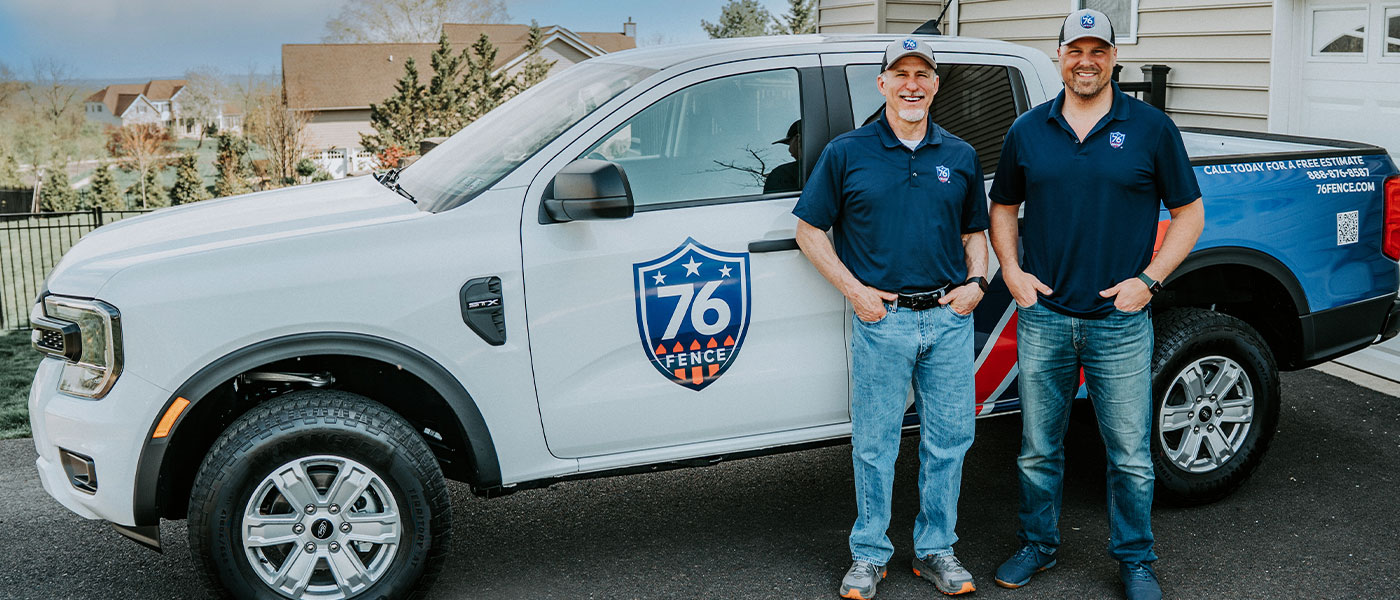 76 Fence BucksMont owners standing by a truck, provided by our fencing company.