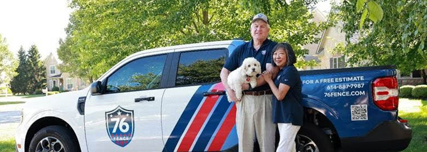 76 Fence Columbus Northwest owners standing by a truck, provided by our fencing company.