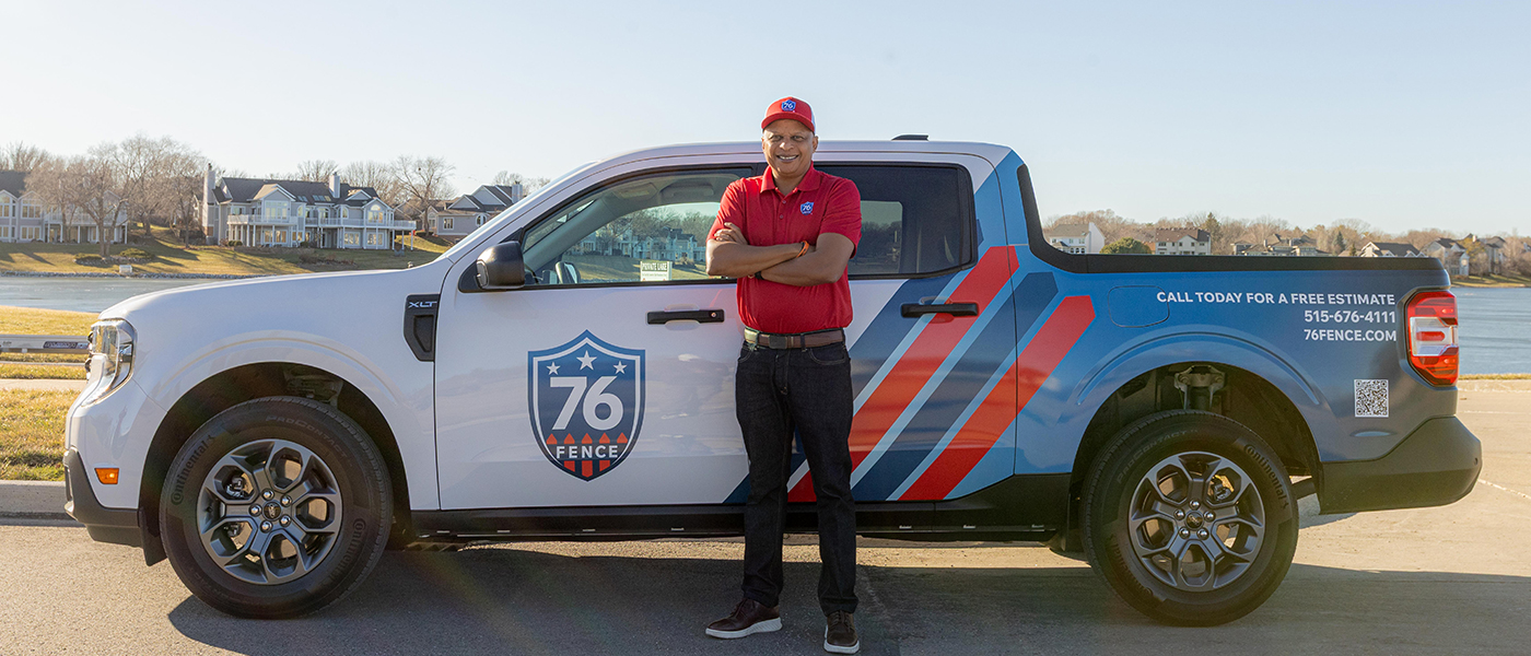 76 Fence Greater Des Moines owners standing by a truck, provided by our fencing company.