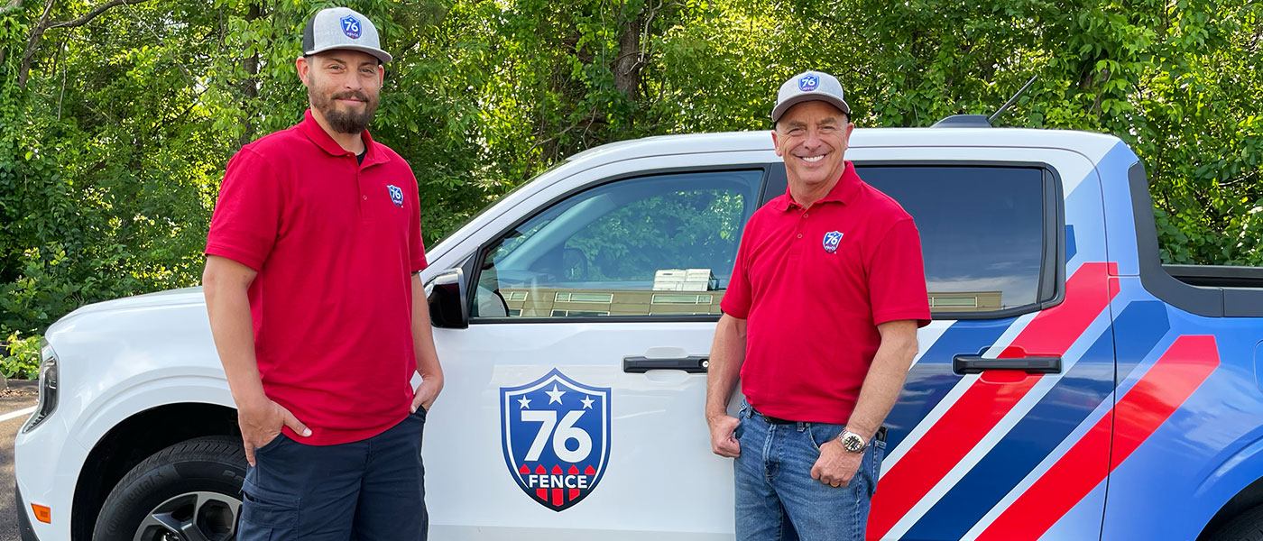 76 Fence Mile High owners standing by a truck, provided by our fencing company.