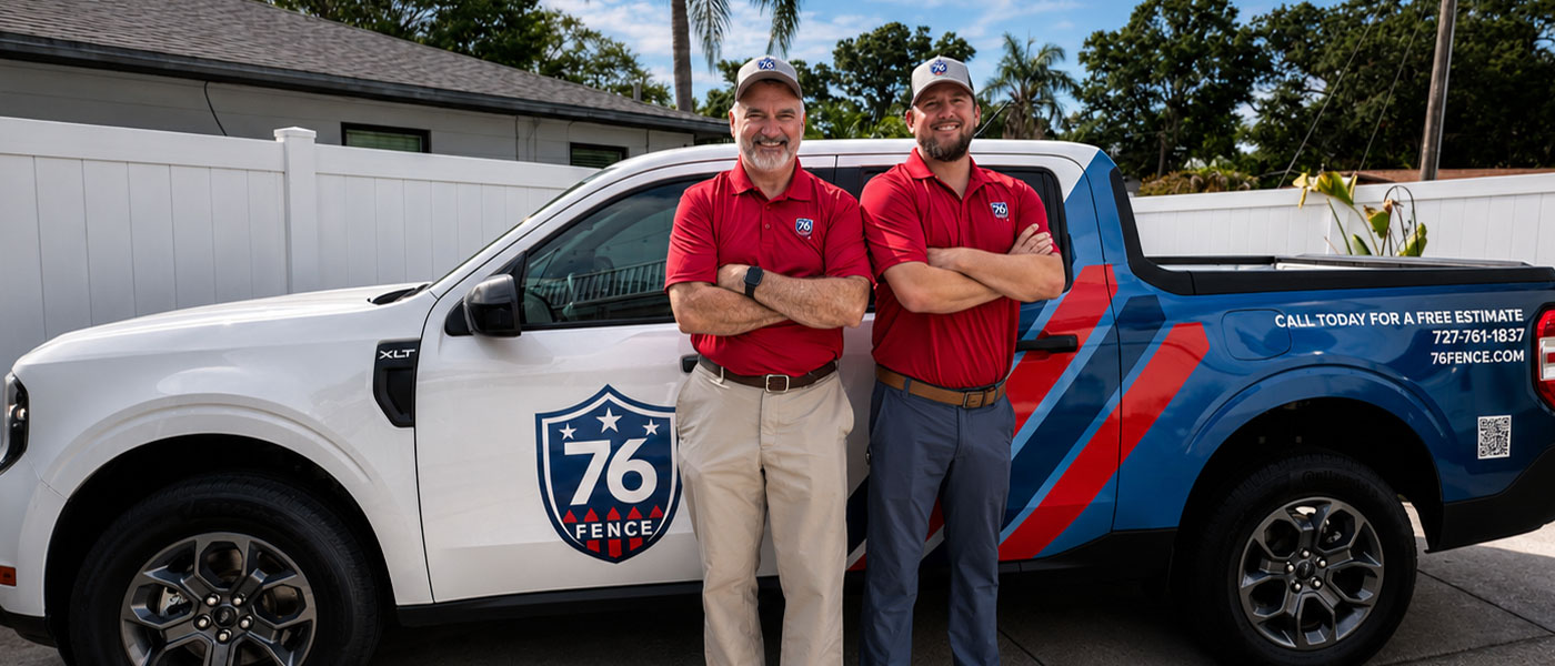 76 Fence Pinellas owners standing by a truck, provided by our fencing company.
