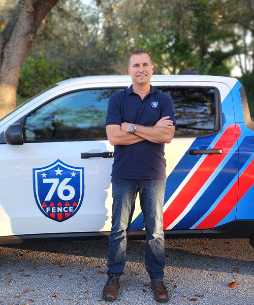 76 Fence Tampa (Lutz) owner standing near a truck
